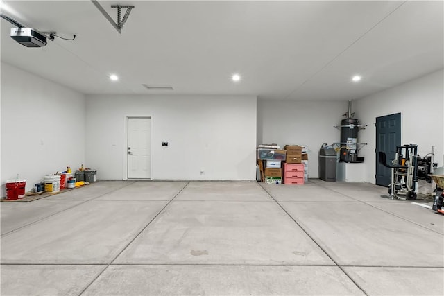 6183 S Lago Grande Dr, Fort Mohave, AZ 86426 - garage with a garage door opener, recessed lighting, and a central vacuum unit