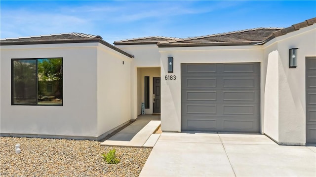 6183 S Lago Grande Dr, Fort Mohave, AZ 86426 - view of front facade with stucco siding and an attached garage