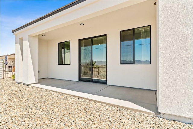 6183 S Lago Grande Dr, Fort Mohave, AZ 86426 - rear view of house featuring stucco siding and a patio area
