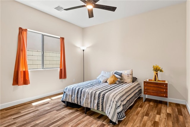 6183 S Lago Grande Dr, Fort Mohave, AZ 86426 - bedroom featuring baseboards, wood finished floors, and ceiling fan