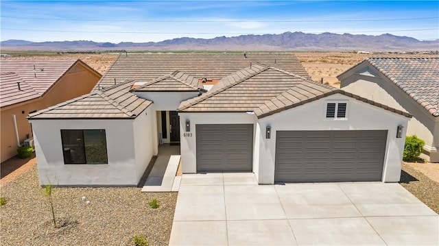 6183 S Lago Grande Dr, Fort Mohave, AZ 86426 - view of front facade with a garage, stucco siding, and a tile roof