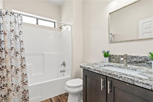 6183 S Lago Grande Dr, Fort Mohave, AZ 86426 - bathroom featuring wood finished floors, vanity, shower / bath combo with shower curtain, and toilet