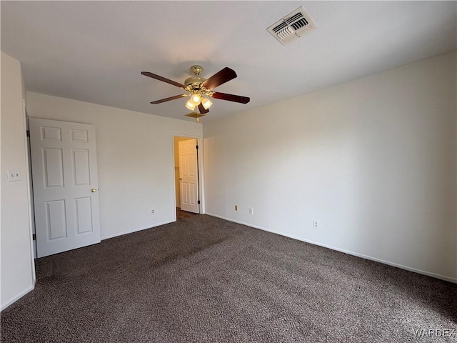 unfurnished bedroom with a ceiling fan, dark colored carpet, visible vents, and baseboards