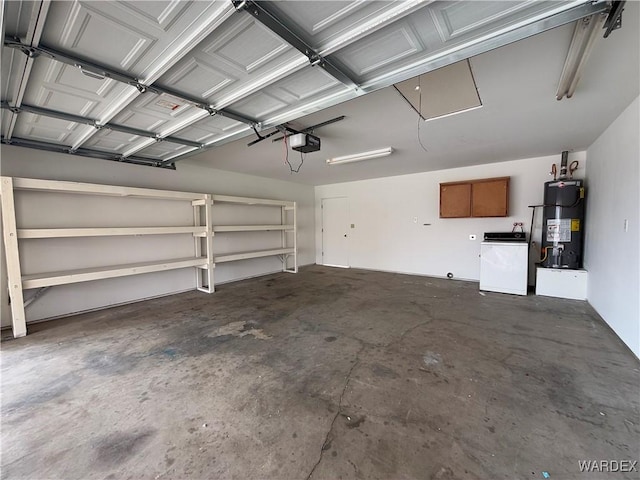 garage featuring a garage door opener, washer / dryer, and water heater