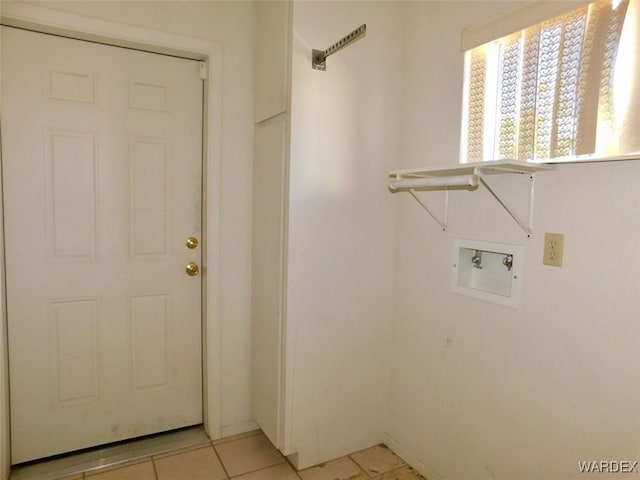 laundry room featuring laundry area, washer hookup, and light tile patterned flooring