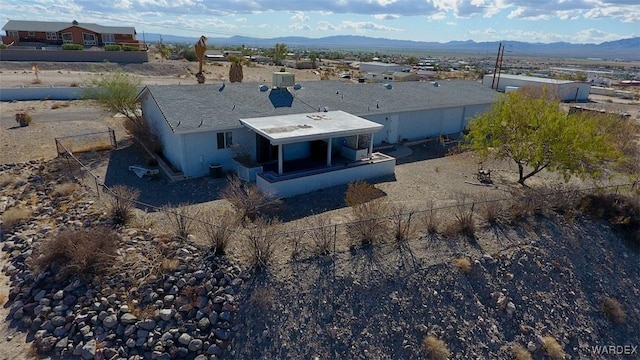 drone / aerial view featuring a mountain view