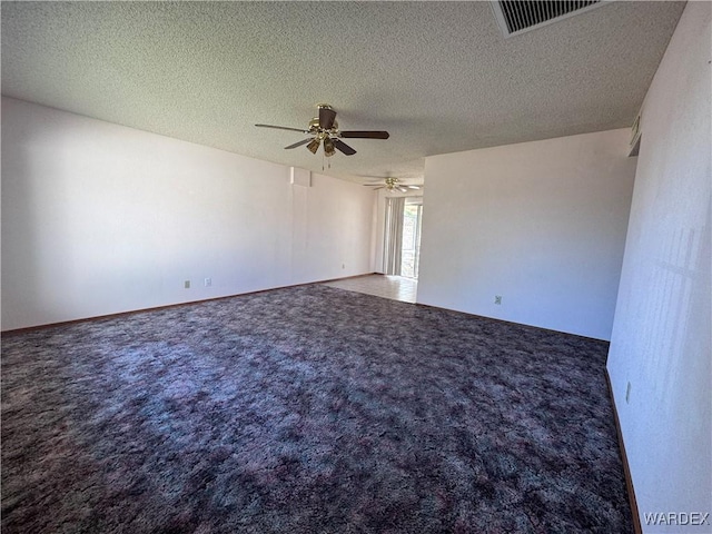 unfurnished room with a textured ceiling, ceiling fan, carpet, and visible vents