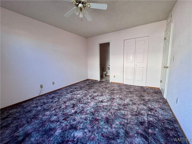 unfurnished bedroom with a closet, baseboards, a ceiling fan, a textured ceiling, and carpet floors