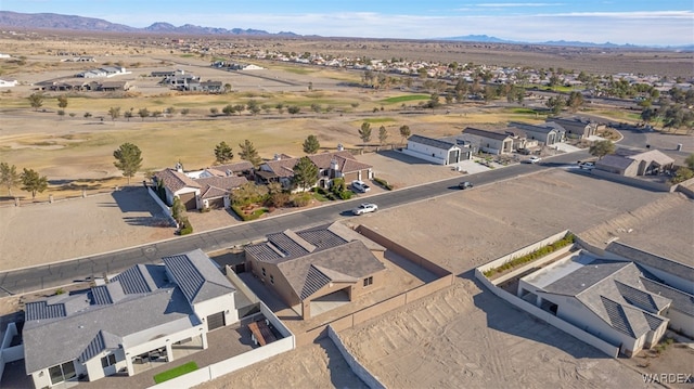 drone / aerial view featuring a residential view and a mountain view