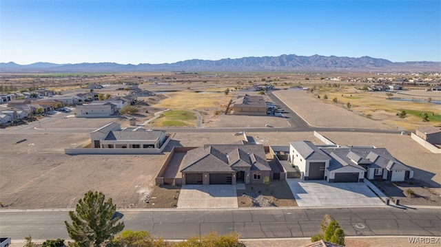 birds eye view of property with a residential view and a mountain view