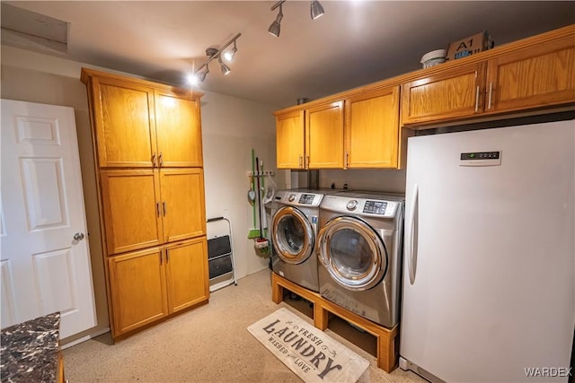 laundry area with cabinet space and washing machine and clothes dryer