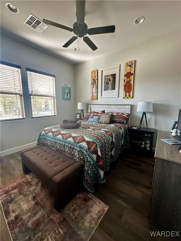 bedroom with recessed lighting, visible vents, baseboards, and wood finished floors