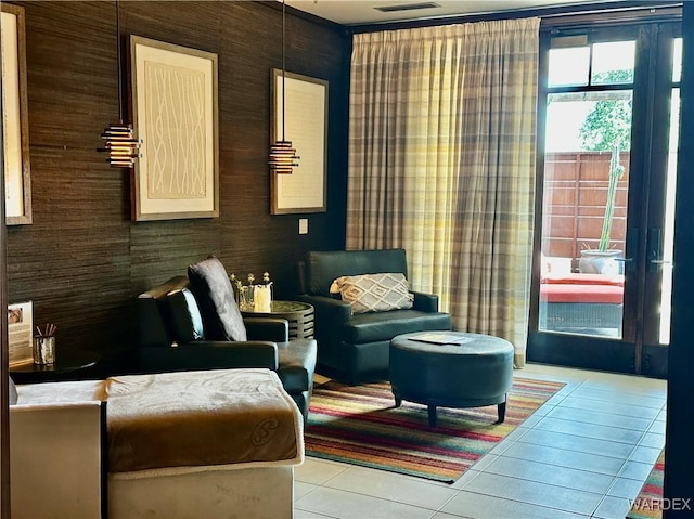 living area with visible vents and tile patterned floors