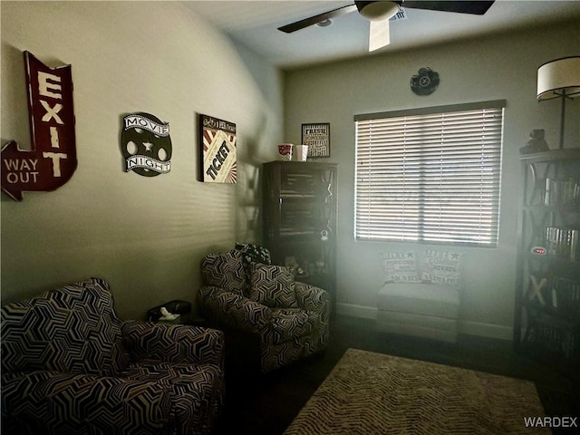 living area with ceiling fan