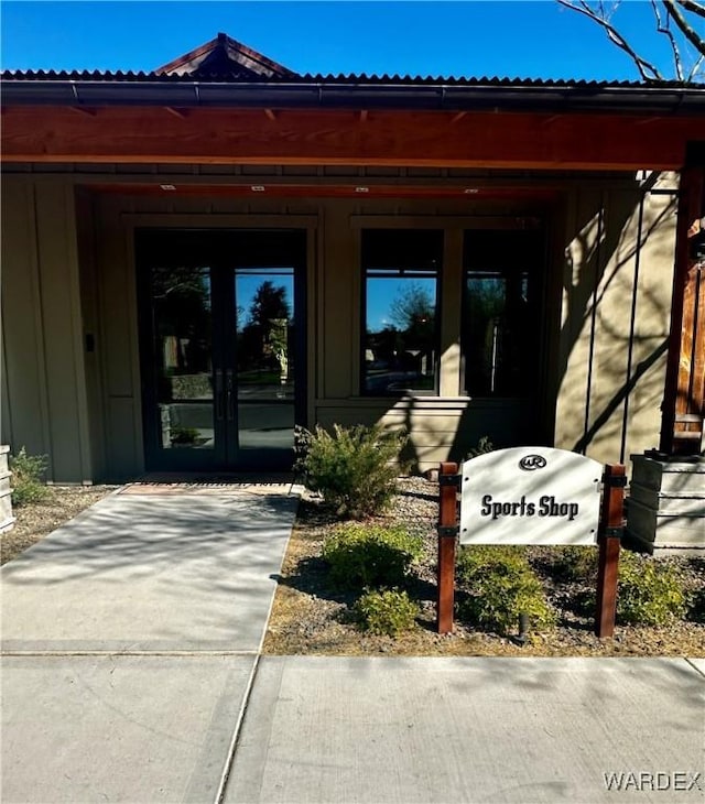 property entrance with french doors and board and batten siding