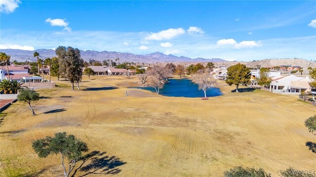 bird's eye view featuring a residential view and a water and mountain view