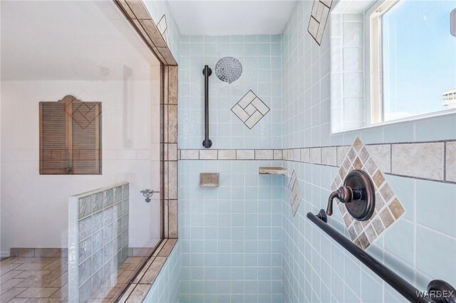 full bathroom with a tile shower