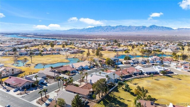 bird's eye view with a residential view and a water and mountain view