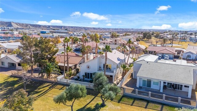 drone / aerial view featuring a residential view and a mountain view