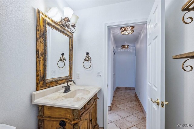 bathroom with tile patterned flooring and vanity