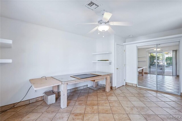 dining room featuring baseboards, visible vents, a ceiling fan, and light tile patterned flooring