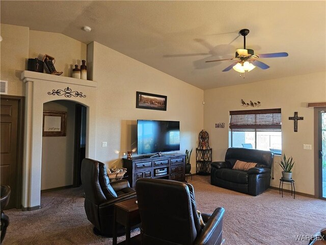 6246 S Vista Laguna Dr, Fort Mohave, AZ 86426 - living area with ceiling fan, arched walkways, lofted ceiling, carpet flooring, and visible vents