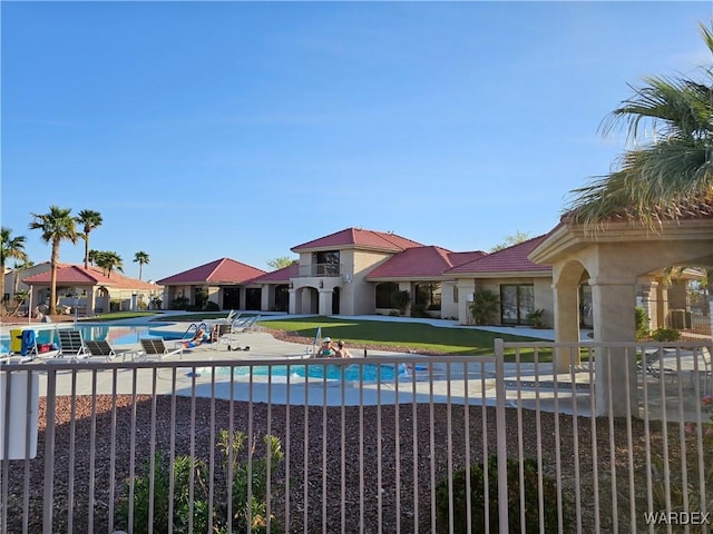 6246 S Vista Laguna Dr, Fort Mohave, AZ 86426 - community pool with a lawn and a patio