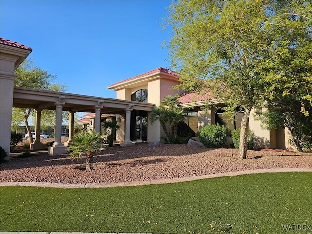 6246 S Vista Laguna Dr, Fort Mohave, AZ 86426 - exterior space featuring a tile roof and stucco siding
