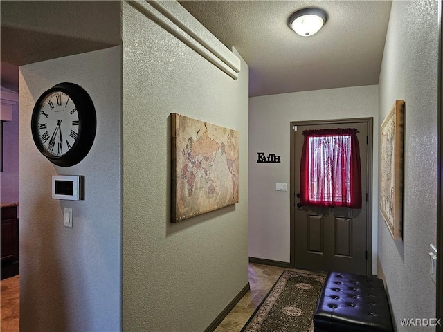 6246 S Vista Laguna Dr, Fort Mohave, AZ 86426 - entryway featuring baseboards and a textured wall