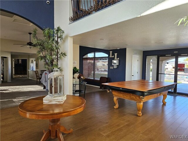 6246 S Vista Laguna Dr, Fort Mohave, AZ 86426 - game room featuring wood finished floors, a healthy amount of sunlight, and a ceiling fan
