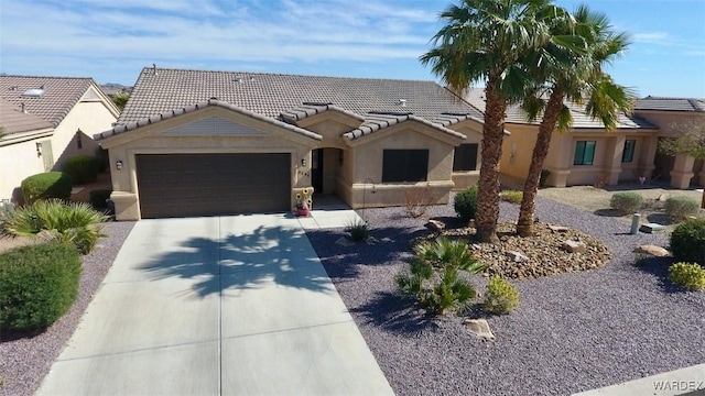 6246 S Vista Laguna Dr, Fort Mohave, AZ 86426 - ranch-style home with a garage, stucco siding, driveway, and a tile roof
