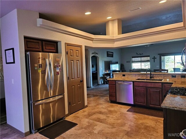 6246 S Vista Laguna Dr, Fort Mohave, AZ 86426 - kitchen with recessed lighting, stainless steel appliances, visible vents, a sink, and open floor plan