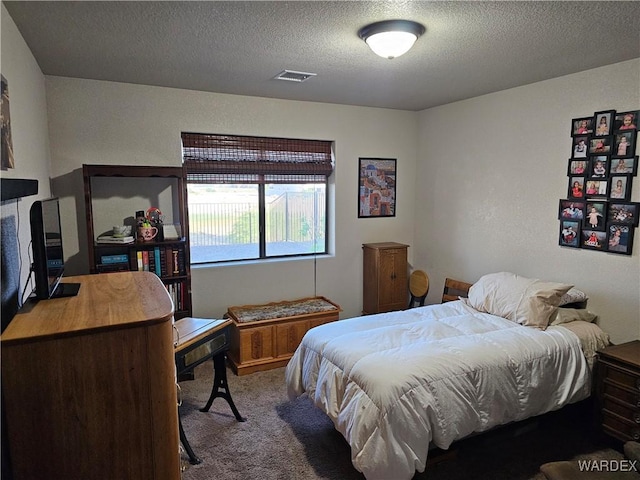 6246 S Vista Laguna Dr, Fort Mohave, AZ 86426 - carpeted bedroom featuring a textured ceiling and visible vents