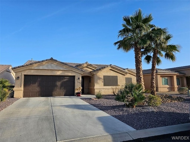 6246 S Vista Laguna Dr, Fort Mohave, AZ 86426 - ranch-style home with concrete driveway, stucco siding, a tiled roof, and a garage