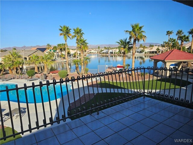 6246 S Vista Laguna Dr, Fort Mohave, AZ 86426 - pool featuring a patio area, fence, a water view, and a residential view