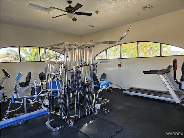 6246 S Vista Laguna Dr, Fort Mohave, AZ 86426 - workout area with visible vents, a textured ceiling, and ceiling fan