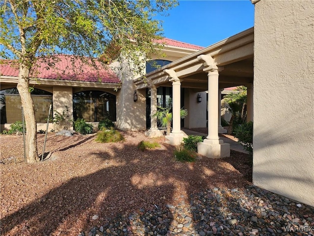 6246 S Vista Laguna Dr, Fort Mohave, AZ 86426 - doorway to property with a tiled roof and stucco siding
