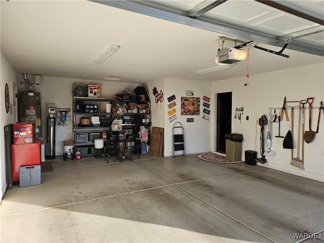 6246 S Vista Laguna Dr, Fort Mohave, AZ 86426 - garage featuring gas water heater and a garage door opener