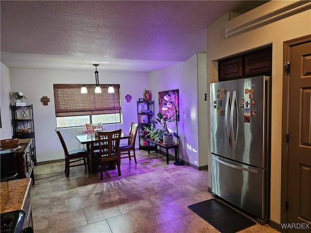 6246 S Vista Laguna Dr, Fort Mohave, AZ 86426 - dining room featuring baseboards and a textured ceiling