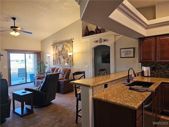 6246 S Vista Laguna Dr, Fort Mohave, AZ 86426 - kitchen featuring lofted ceiling, a ceiling fan, a sink, carpet flooring, and open floor plan