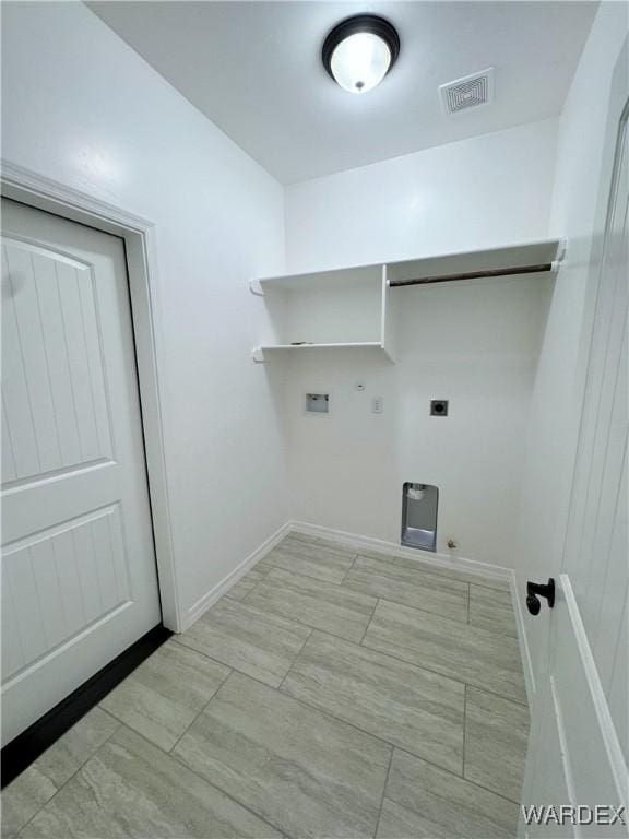 clothes washing area with laundry area, visible vents, gas dryer hookup, hookup for a washing machine, and electric dryer hookup