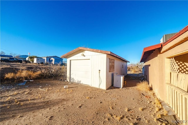 view of outdoor structure featuring an outbuilding and ac unit