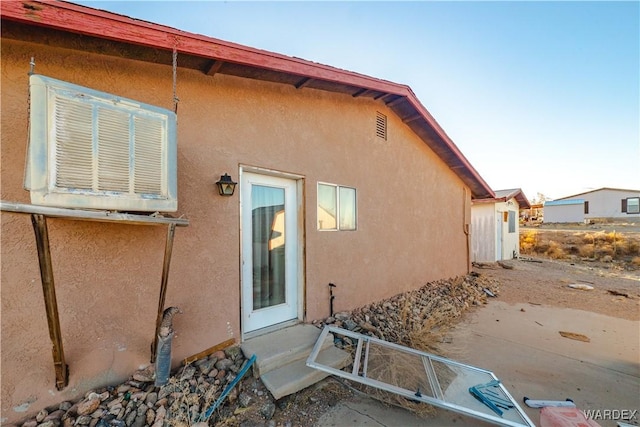 view of home's exterior with a patio area and stucco siding