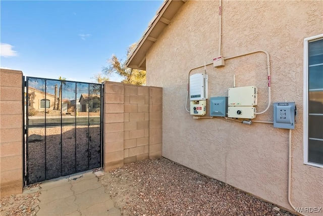 view of gate with fence