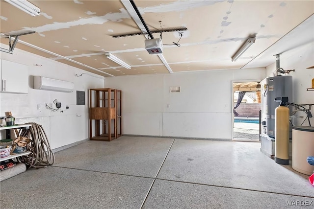 garage featuring water heater, a wall mounted AC, electric panel, and a garage door opener