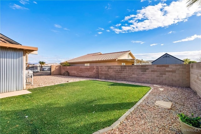 view of yard with a fenced backyard