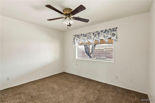 carpeted empty room featuring a ceiling fan