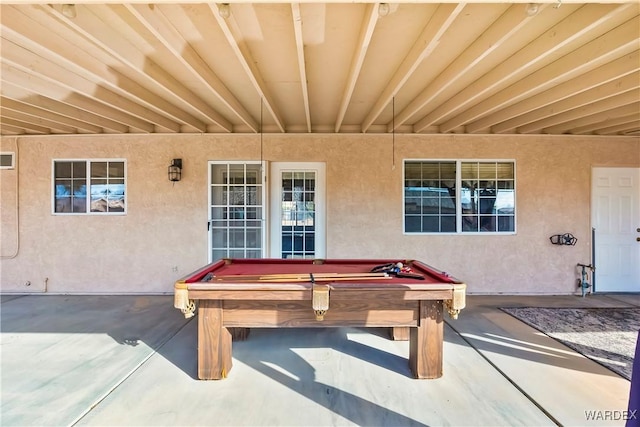 recreation room with billiards and concrete floors