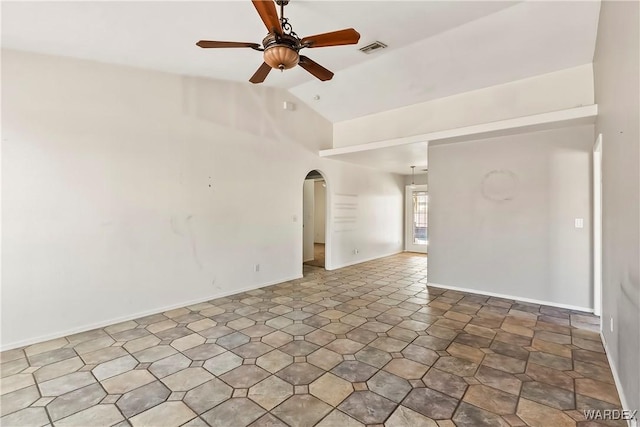 spare room with baseboards, visible vents, arched walkways, a ceiling fan, and lofted ceiling