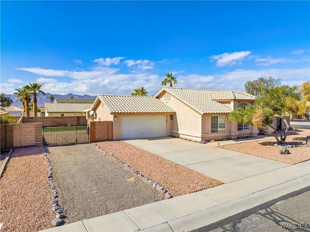 view of front facade featuring driveway, a tiled roof, an attached garage, fence, and stucco siding